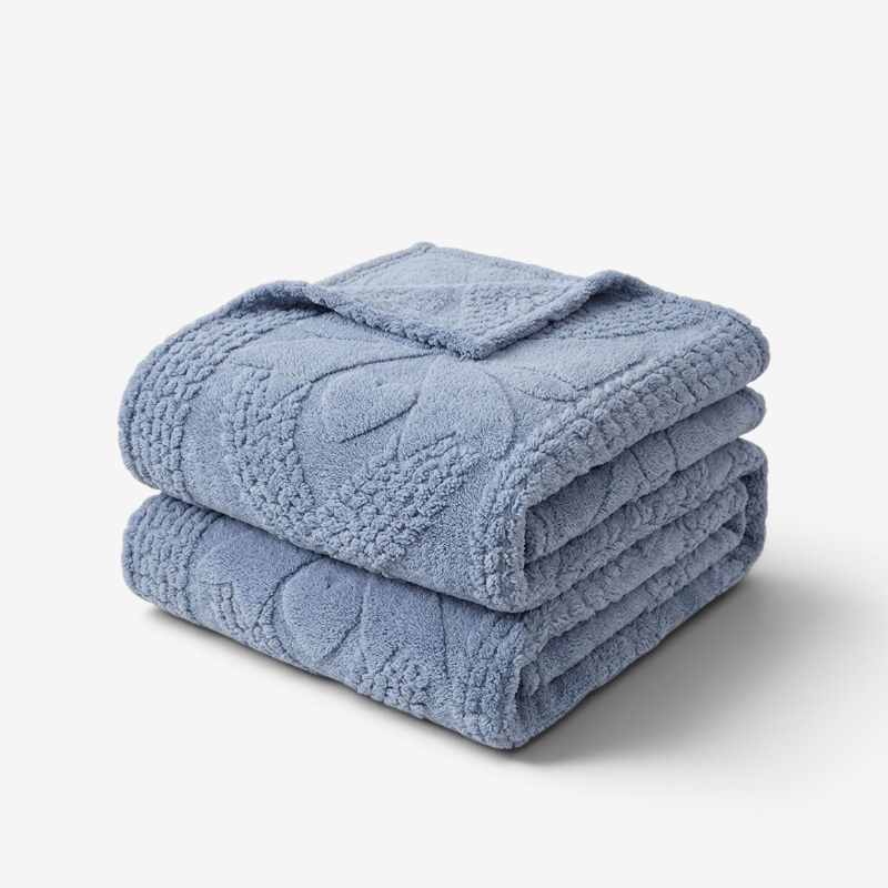 Lévane – Dobbeltsidet plaid med jacquarddesign og forskellige strukturer