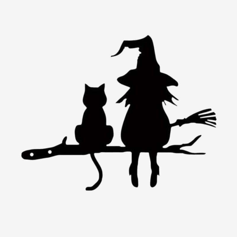Décoration de jardin avec une sorcière et un chat