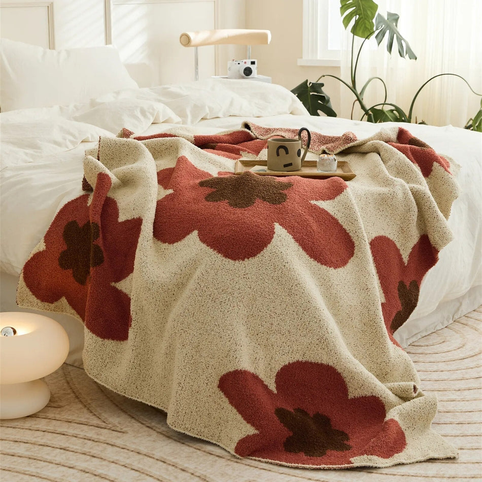 FloraNest – Blødt tæppe med blomstermønster til seng og sofa